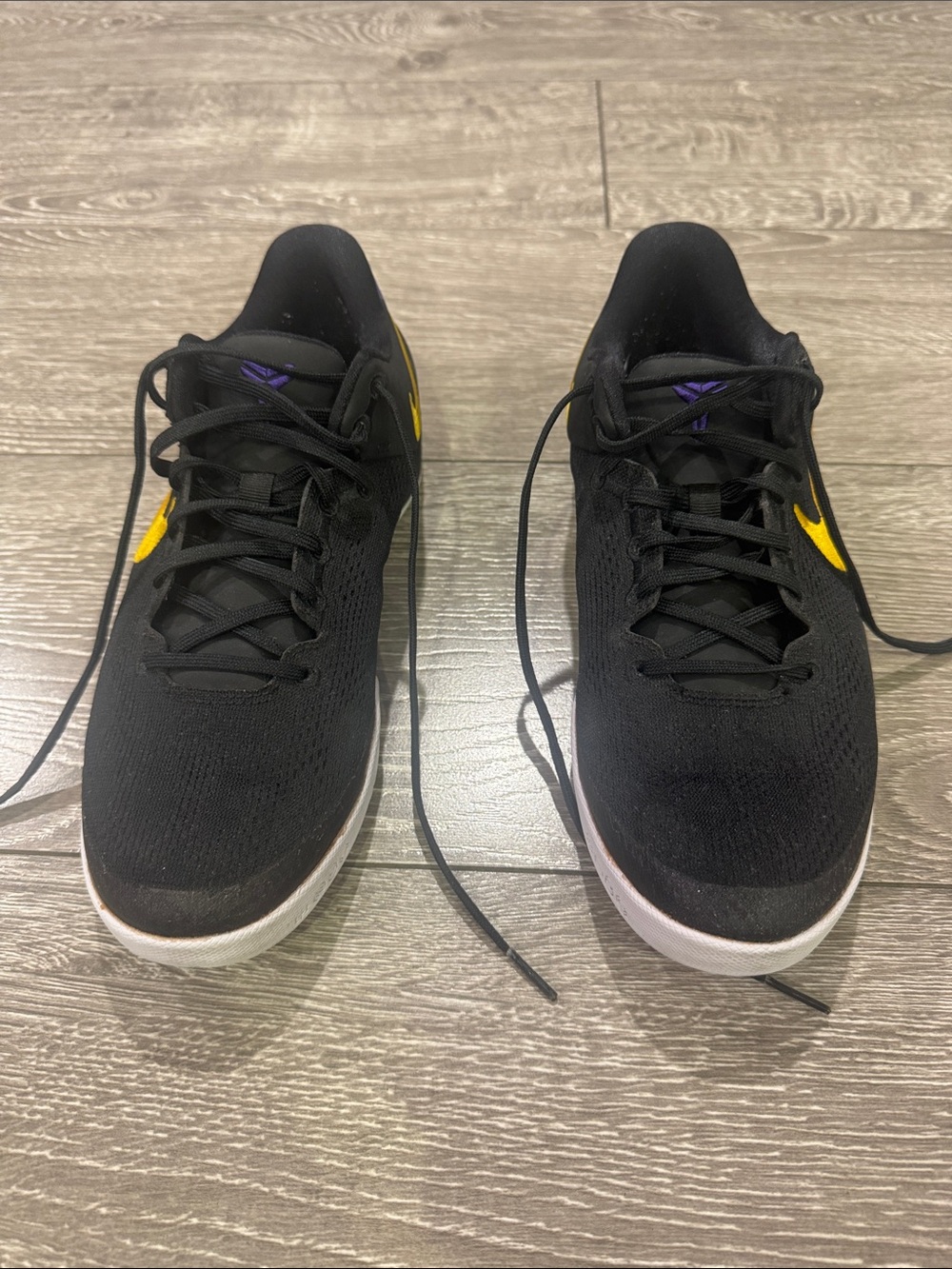 Nike Black Low-Top Sneakers with Yellow Swoosh and Purple Tongue Logo